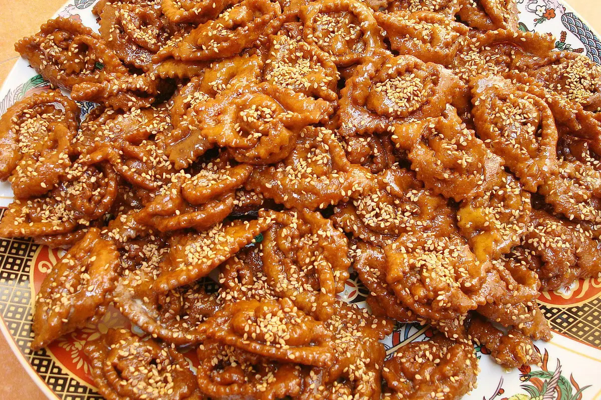 Glazed Moroccan Chebakia sesame flower pastries glistening with honey